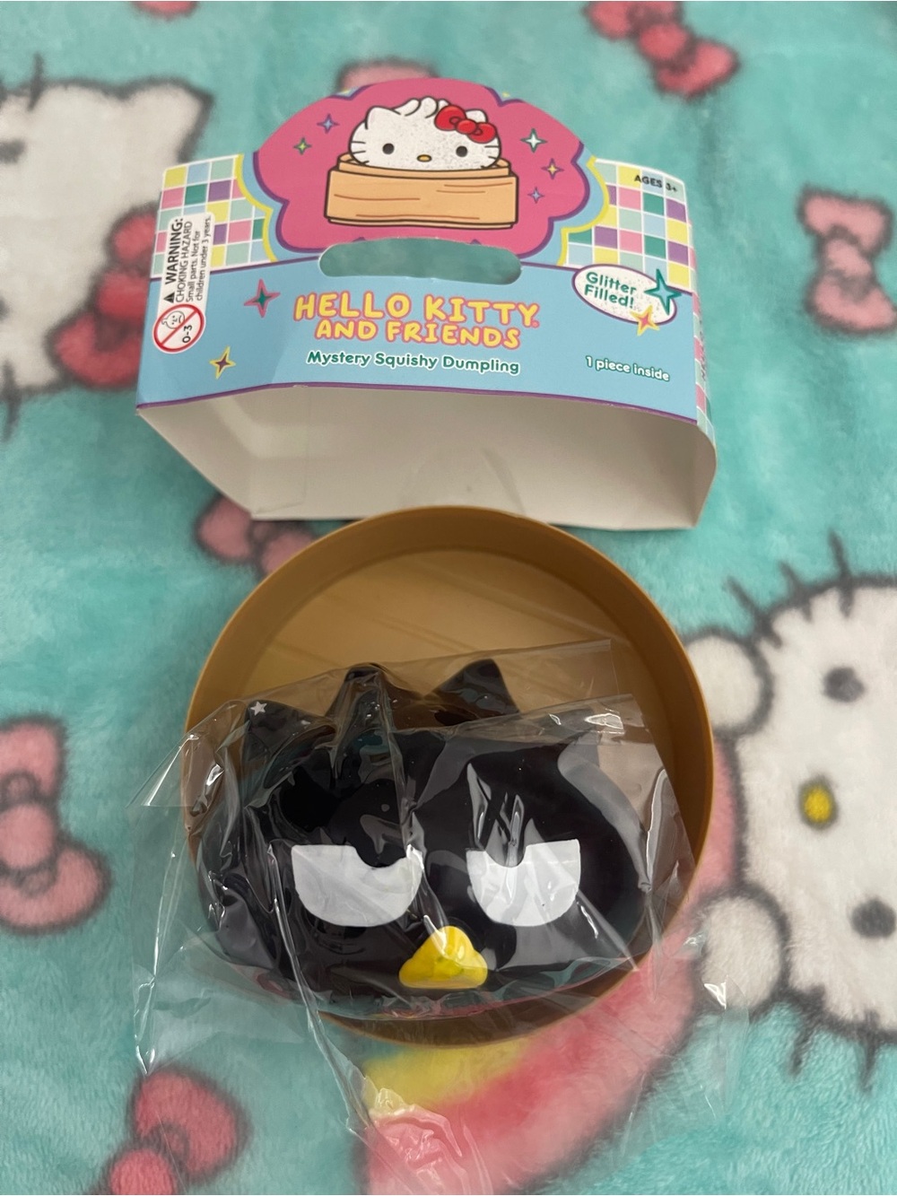 Hello Kitty & Friends Mystery Squishy Dumpling Glitter Filled - Badtz Maru